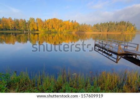 Idyllic morning lake landscape in autumn season