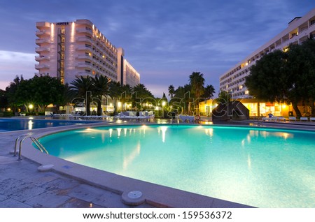 CLUB MAC HOTEL, MAJORCA-SEPTEMBER 08: Evening view for swimming pool near Club Mac hotel resort in Alcudia, in September 08,2013 on Majorca. Club Mac hotel resort have 1024 air-conditioned guestrooms.
