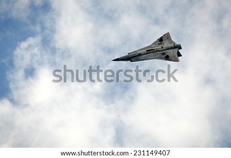 KALLINGE, SWEDEN - JUNE 01, 2014: Swedish Air Force air show 2014 at F 17 Wing. Saab 35 Draken with double delta wing in flight.
