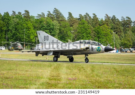 KALLINGE, SWEDEN - JUNE 01, 2014: Swedish Air Force air show 2014 at F 17 Wing. Saab 35 Draken with double delta wing on a runway.