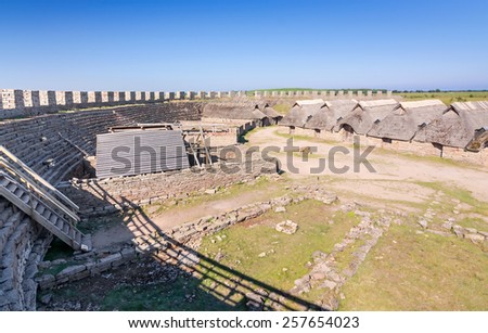 OLAND, SWEDEN - JUNE 21: Eketorp castle village - view from the wall, on Oland island on June 21,2014 in Sweden. Eketorp castle - built between 400-600AD and it\'s  tourist attraction on Oland island.