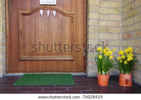 Entry home door with flower decoration