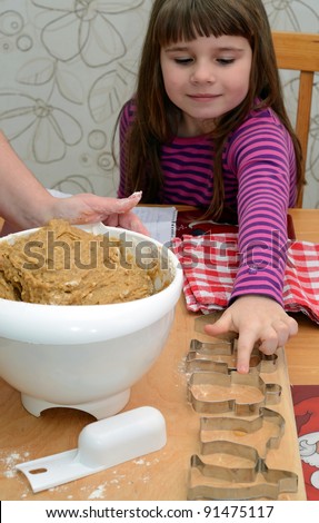 Child girl help with making cake