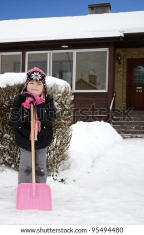 Child girl smiling after snow work
