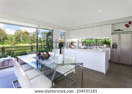 Modern kitchen with stainless steel appliances in Australian mansion
