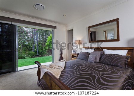 Stylish master bedroom in luxury Australian mansion