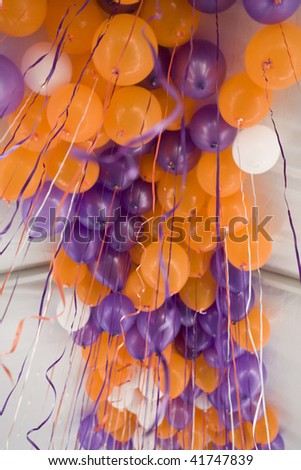 orange and purple balloons in the ceiling