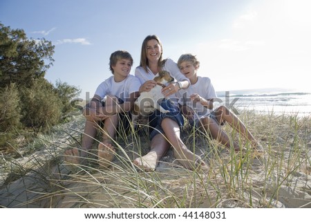 Family sitting on the beach