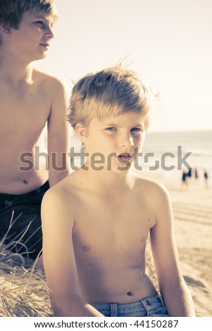 two young brothers at the beach