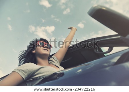 Girl looks out the window when riding in a car