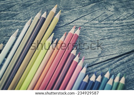 Crayons on wooden table background