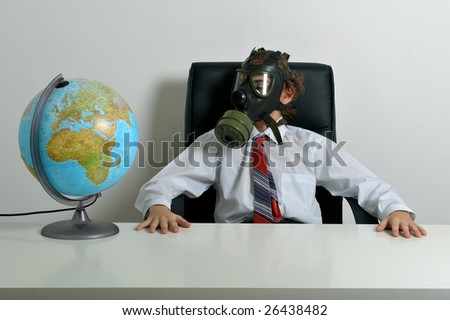 Businessman with gas mask on face looking at earth globe