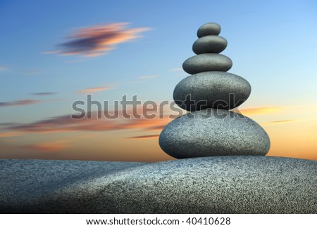 Tower of stone in balance at sunset