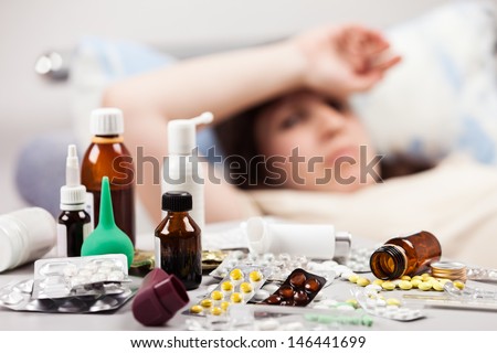 Adult Woman Patient With High Temperature Lying Down Bed For Cold And Flu Illness Relief