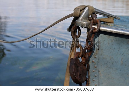 Chain with padlock on boat
