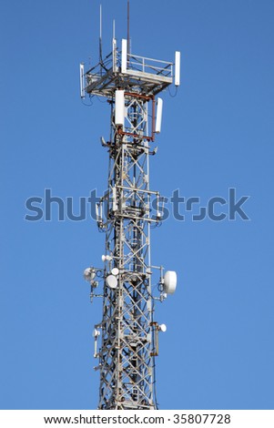 Communications antenna tower with repeater equipment
