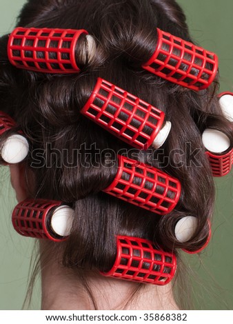 Curlers hair roller on adult beauty women