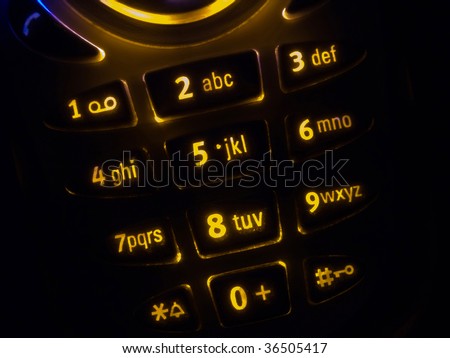Mobile phone keypad back lit macro image on black