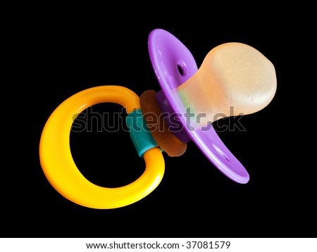 Plastic baby pacifier or soother isolated on black