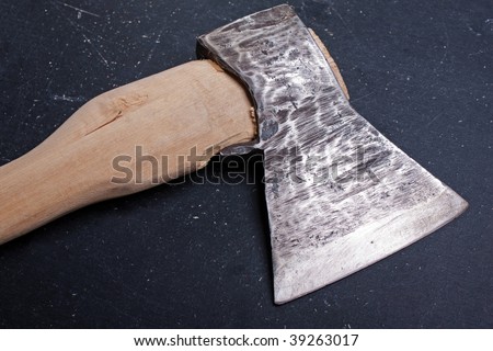 Sharp metal hatchet or axe wood cutting work tool
