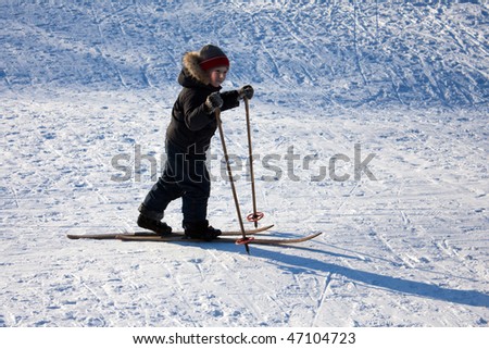 Winter snow ski sport - little child fun skiing