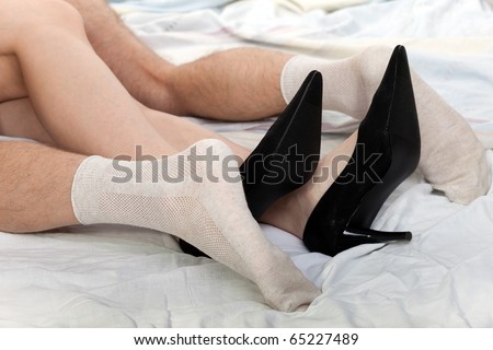 stock photo Human sex men and women couple naked foot on bed