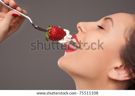 Gourmet strawberry eating with fork