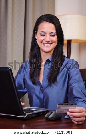 woman pays bills online