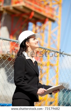 Woman looking up at construction site
