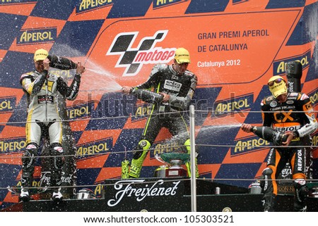 BARCELONA - SPAIN JUNE 3: Champagne for the Moto2 race winners at 2012 Aperol MotoGP of Catalunya at Montmelo circuit on June 3, 2012