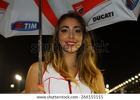 LOSAIL - QATAR, MARCH 29: Beautiful grid girl at 2015 Commercial Bank MotoGP of Qatar at Losail circuit on March 29, 2015