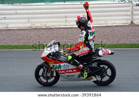 SACHSENRING, GERMANY - JULY 19:Racewinner Marco Simoncelli from Italy greets the crowd after the 250cc race at Alice German Motorcycle GP at Sachsenring , Germany