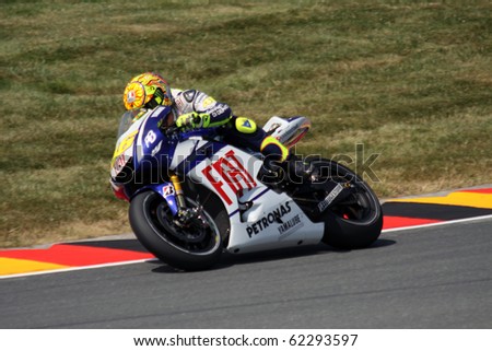 SACHSENRING, GERMANY - JULY 16: Italian rider Valentino Rossi pushes hard during practice at Eni German Motorcycle Grand Prix 2010 on July 16, 2010 in Sachsenring, Germany