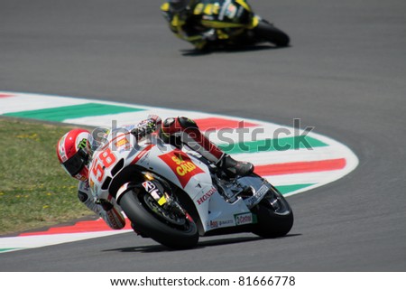 MUGELLO - ITALY, JULY 3: Italian Honda rider Marco Simoncelli pushes hard during 2011 TIM MotoGP of Italy on July 3, 2011