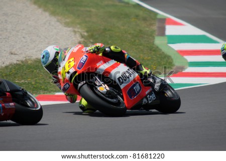 MUGELLO - ITALY, JULY 3: Italian Ducati rider Valentino Rossi pushes hard at 2011 TIM MotoGP of Italy on July 3, 2011
