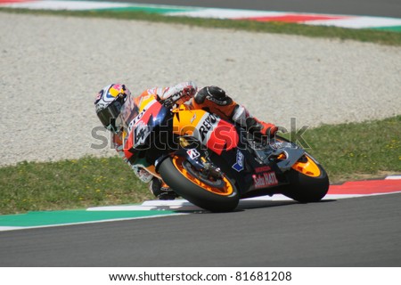 MUGELLO - ITALY, JULY 3: Italian Honda rider Andrea Dovizioso pushes hard at 2011 TIM MotoGP of Italy on July 3, 2011