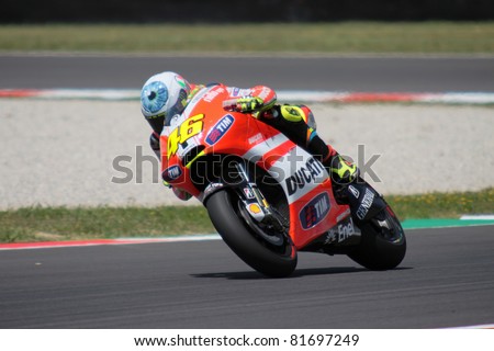 MUGELLO, ITALY - JULY 3: Italian rider Valentino Rossi pushes hard at 2011 TIM MotoGP of Italy on July 3, 2011 in Mugello, Italy