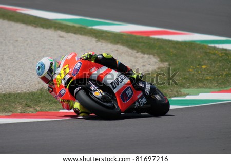 MUGELLO, ITALY - JULY 3: Italian Ducati rider Valentino Rossi pushes hard at 2011 TIM MotoGP of Italy on July 3, 2011 in Mugello, Italy