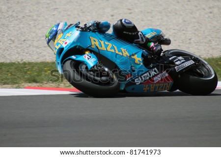 MUGELLO - ITALY, JULY 3: Spanish Suzuki rider Alvaro Bautista pushes hard at 2011 TIM MotoGP of Italy on July 3, 2011