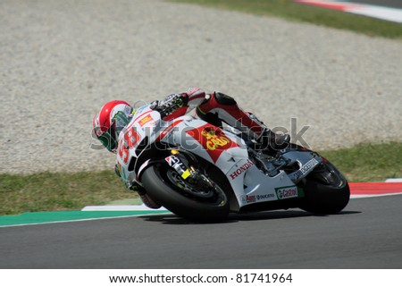 MUGELLO - ITALY, JULY 3: Italian Honda rider Marco Simoncelli puhes hard at 2011 TIM MotoGP of Italy on July 3, 2011