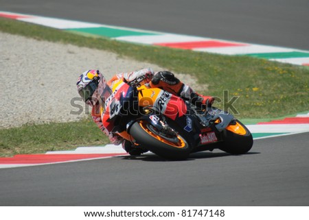 MUGELLO - ITALY, JULY3: Italian Honda rider Andrea Dovizioso pushes hard at 2011 TIM MotoGP of Italy on July 3, 2011