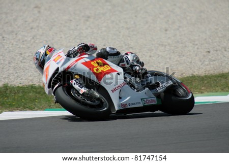 MUGELLO - ITALY, JULY3: Japanese Honda rider Hiroshi Aoyama pushes hard at 2011 TIM MotoGP of Italy on July 3, 2011