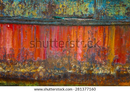Bright blue and Red panels with oxidized or rusty marks produce a colorful painted surface that is full of texture and patterns