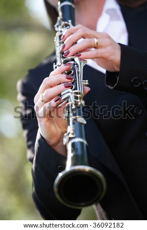 a woman playing clarinet