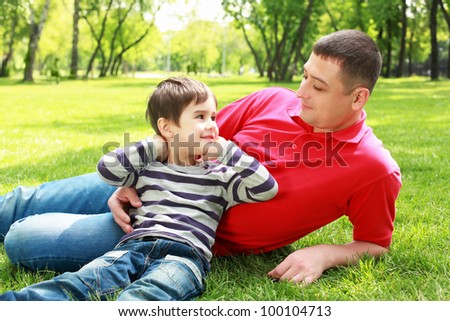 Father with his son in the summer park