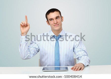 Portrait of a man in business wear making presentation