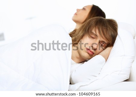 Young man and his wife go to bed