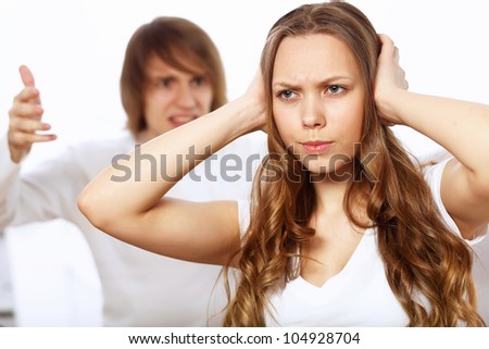 stock-photo-young-man-and-woman-angry-and-conflicting-104928704.jpg