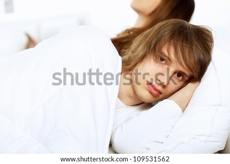 Young man and his wife go to bed