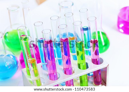 Chemistry laboratory glassware with colour liquids in them